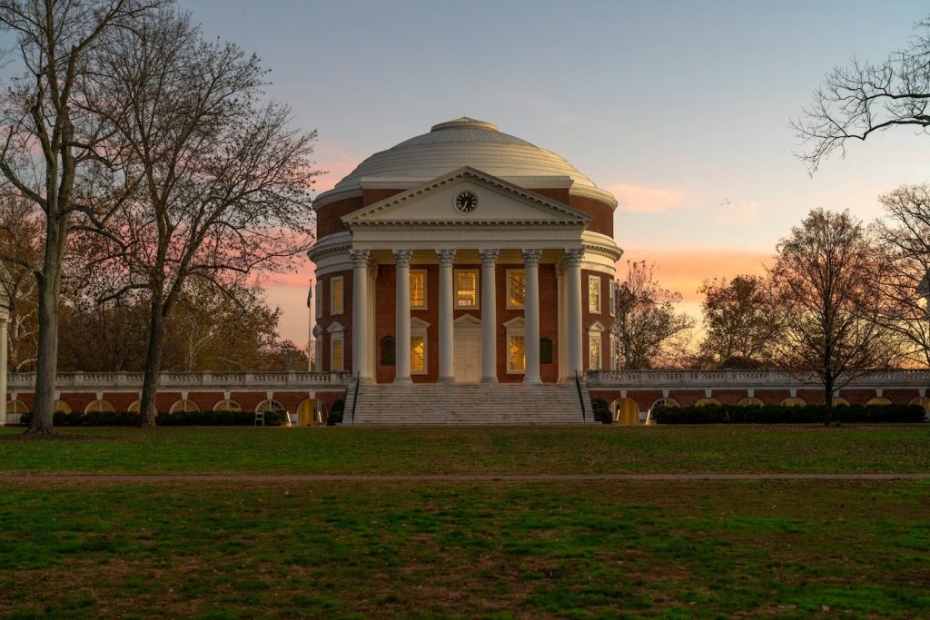 a building with a dome in the middle of a field